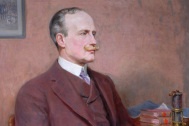 Painting of gentleman wearing a brown suit, sitting in a wooden chair and holding a paper