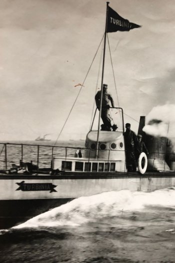 Black and white photo of the Turbinia steam ship at Spithead