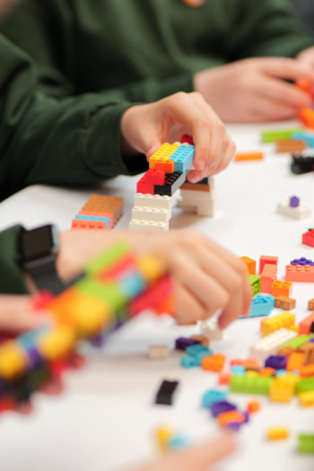 Children play with LEGO